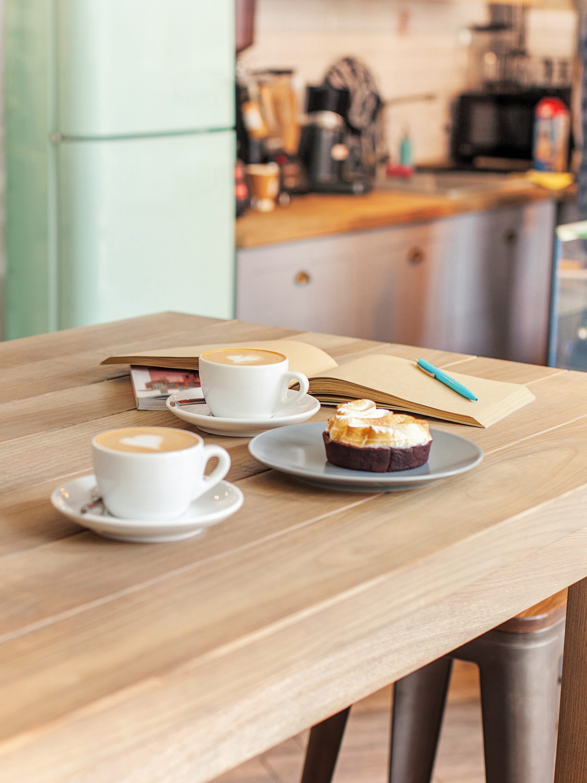 A table setting for coffee on the counter at a coffee house