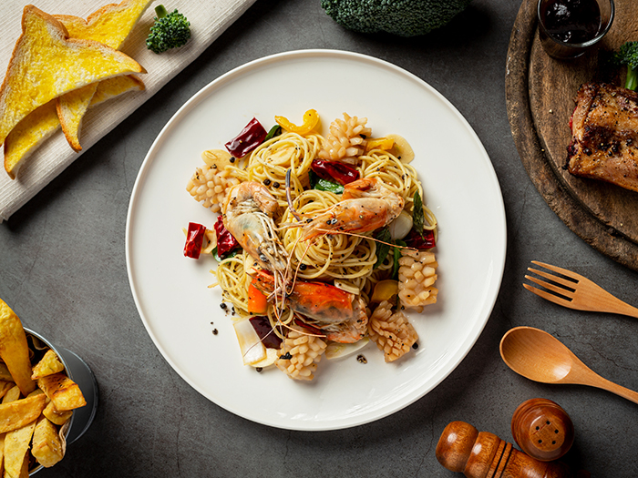 Spaghetti with Spicy Mixed Seafood on dark background