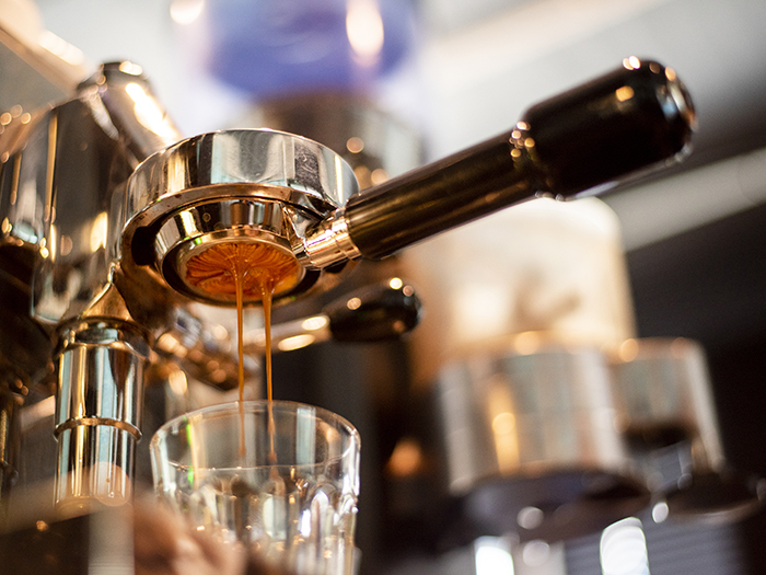 Close up of coffee machine is preparing coffee in coffee shop