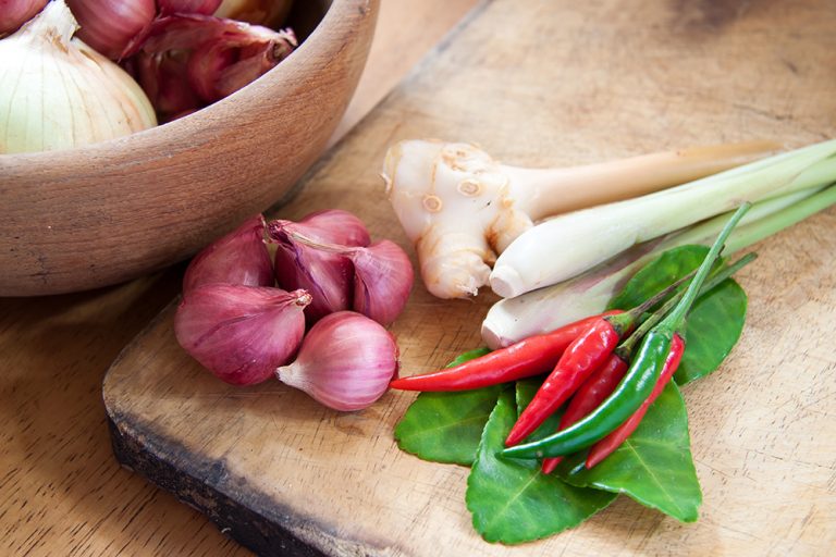Asian hot and spicy food ingredient with onions in wooden bowl