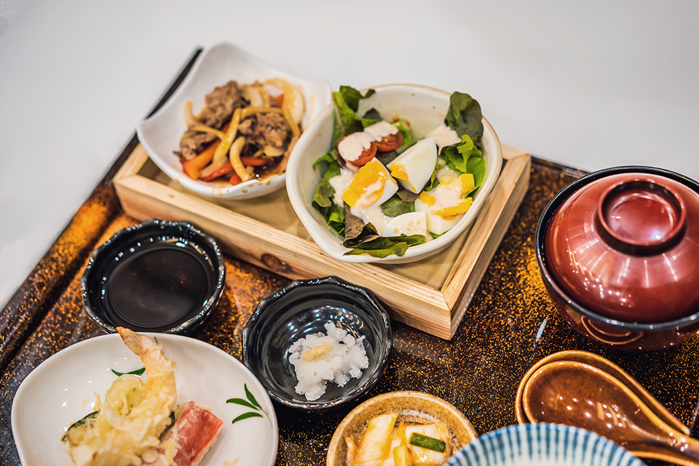 Bento set of prawn tempura and chicken teriyaki in japanese restaurant