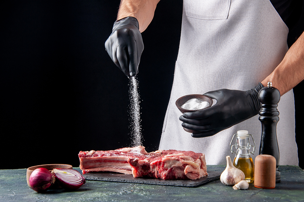 front view male butcher salting meat on dark background food ani