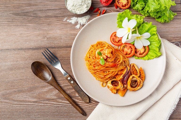 Spaghetti Seafood with Tomato Sauce Decorated with beautiful ing