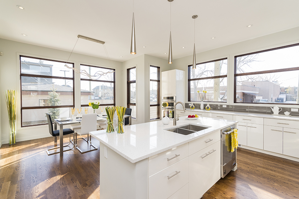 Interior shot of a modern house kitchen with large windows