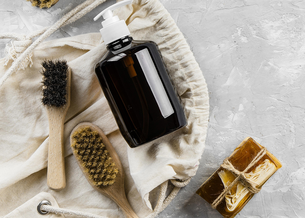 flat-lay-eco-friendly-cleaning-products-with-variety-brushes-copy-space